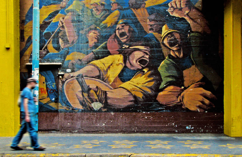 Blue and yellow mural in the neighbourhood of La Boca in Buenos Aires, Argentina