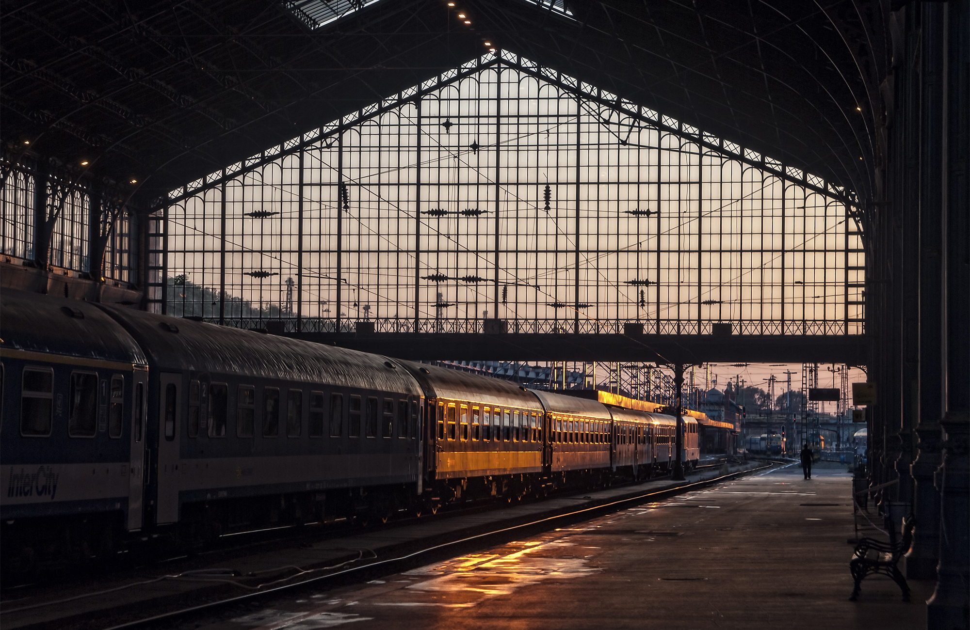 Image of a train station at sunset in Europe - KILROY