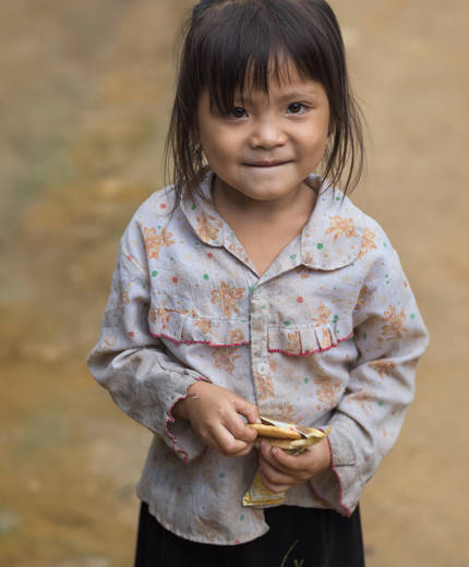 Image of a smiling young girl in Cambodia - KILROY