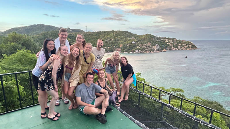 Image of a group of travellers at a scenic view point on Koh Tao island in Thailand - KILROY